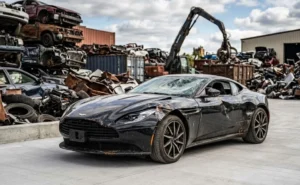 Damaged luxury electric car at a GTA scrap yard ready for auto recycling in Ontario.