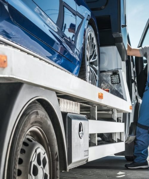 repo-company-driver-towing-repossessed-vehicle.jpg
